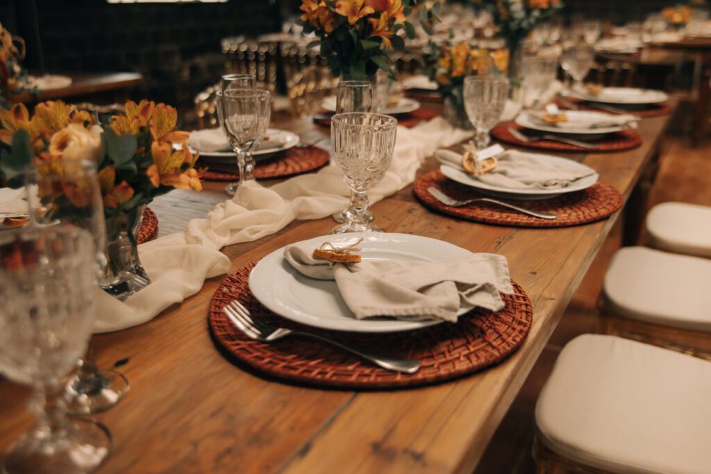 Beautifully arranged wedding reception table with elegant floral decor and glassware.